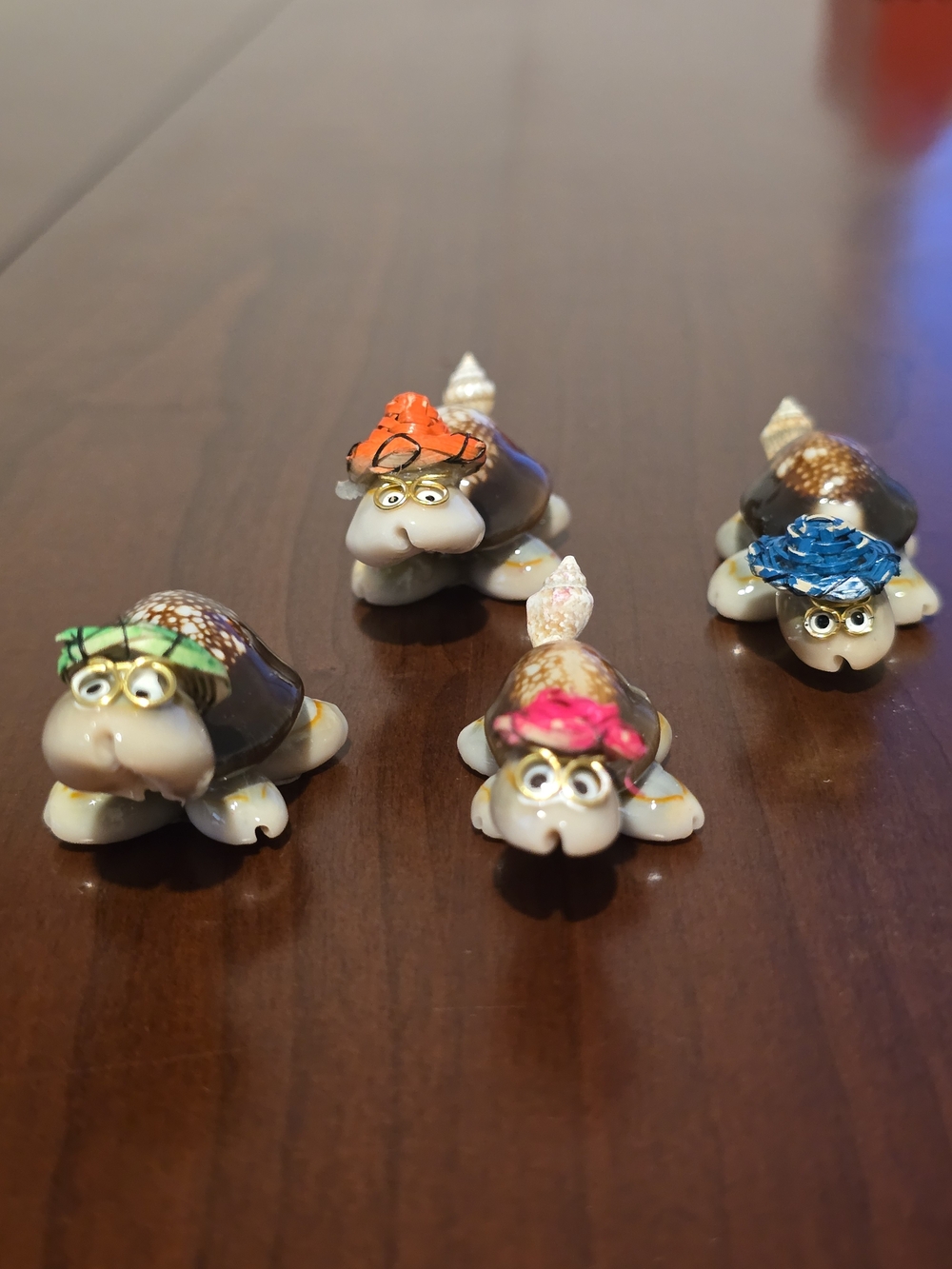 Four Cute Handmade Mini Turtles Made From Seashells with Glasses and Straw Hats